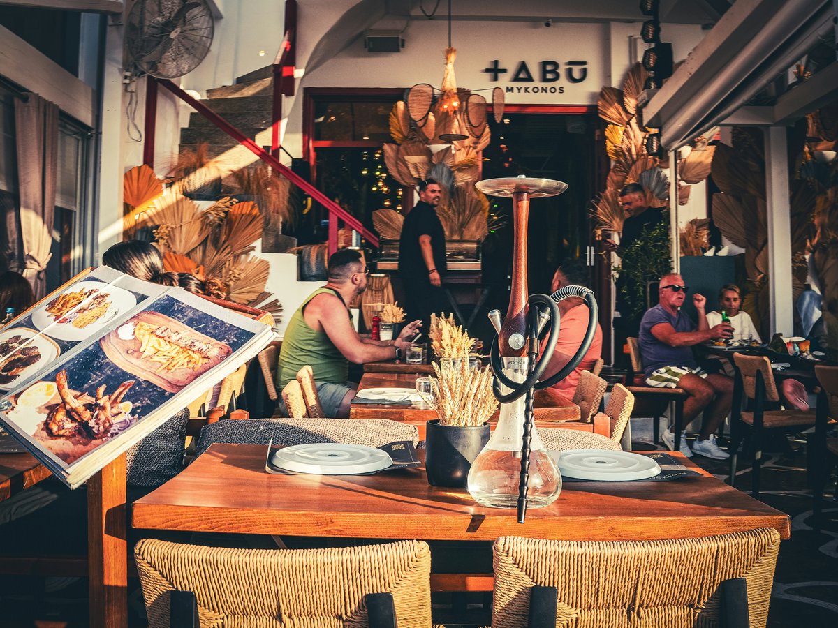 A group of people sitting around a wooden table