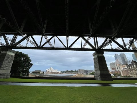 a large metal bridge over a river