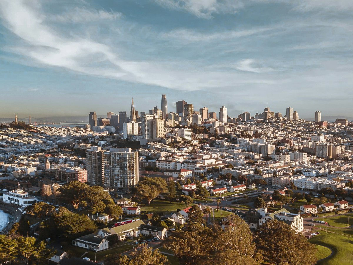 city skyline under blue sky during daytime