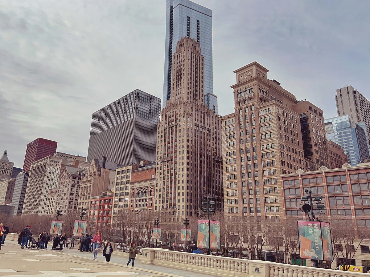 a group of people walking in a city