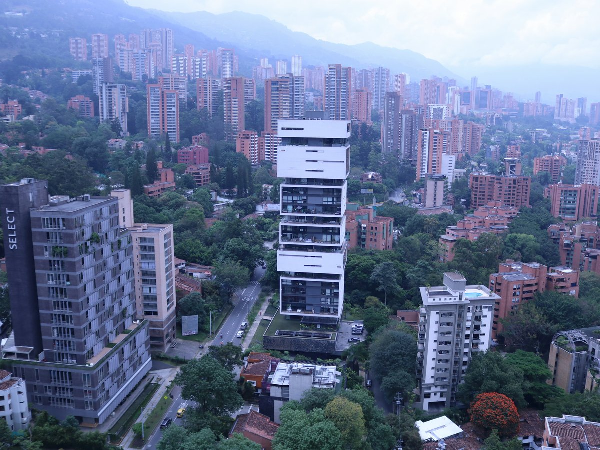 an aerial view of a city with tall buildings