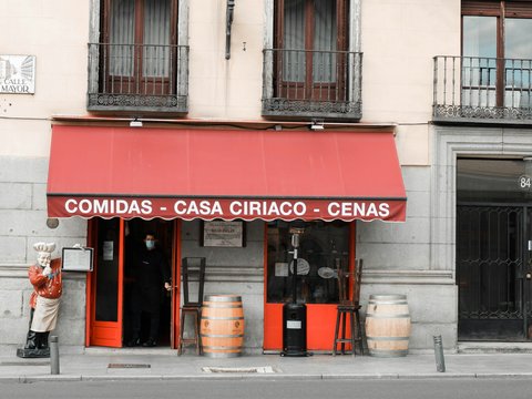 a store front with a red sign