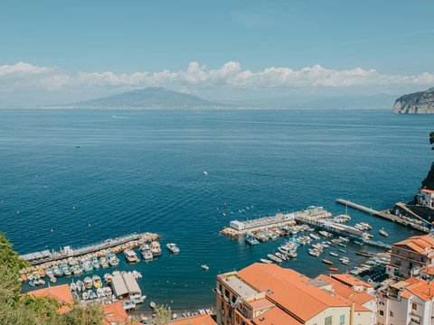 a view of a harbor with boats in the water