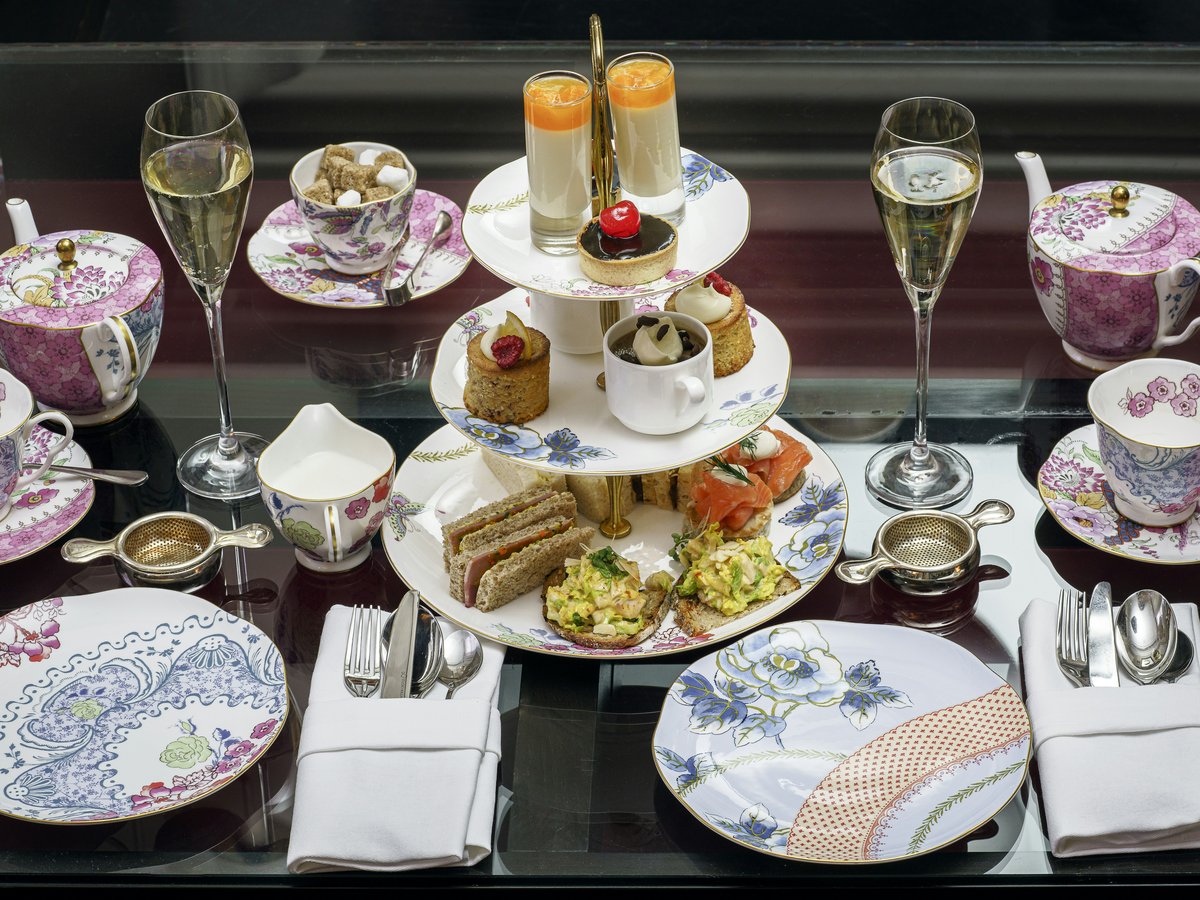 assorted pastries in rack between plates