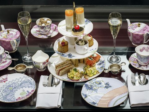 assorted pastries in rack between plates