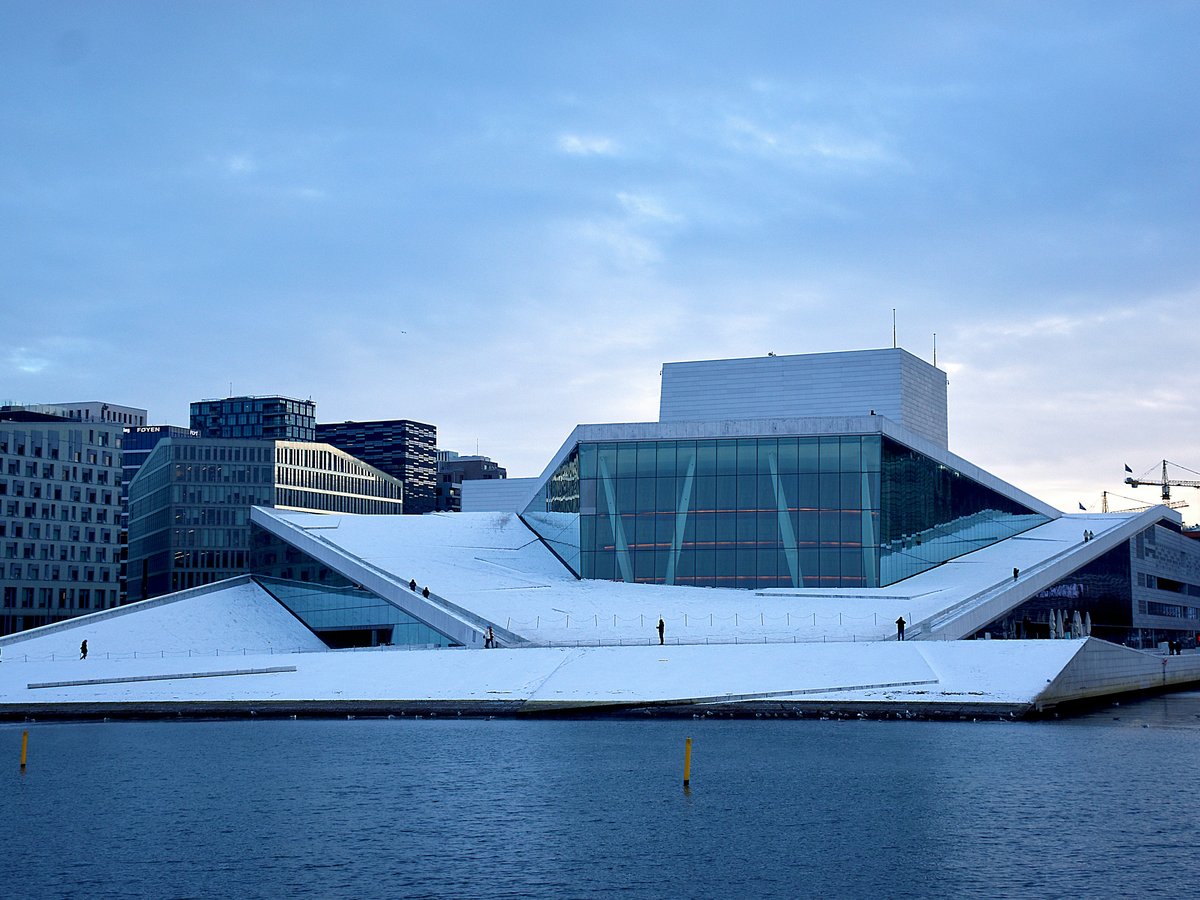 a large building sitting next to a body of water