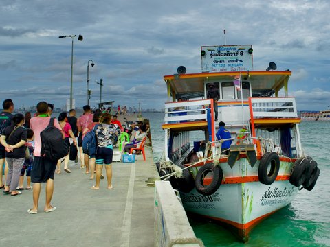 a boat is parked on the side of a dock