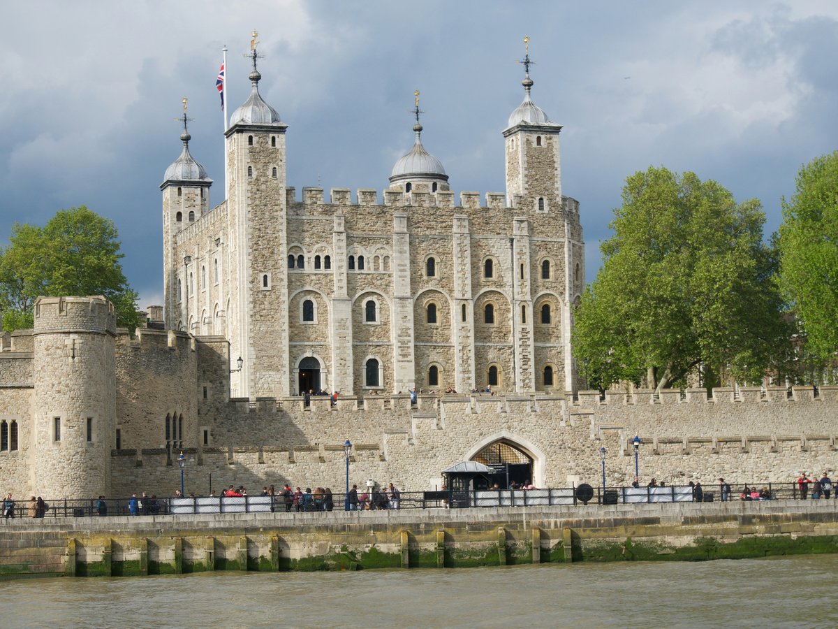 a large castle with a bridge going through it