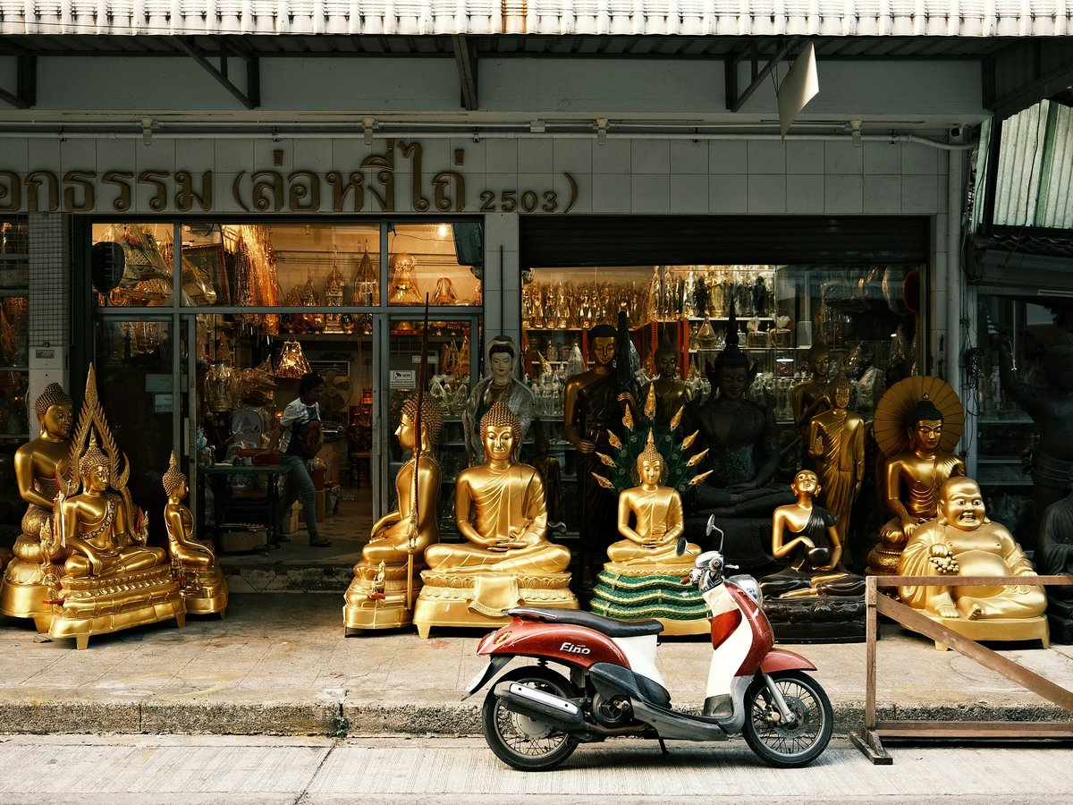 a motor scooter parked in front of a store