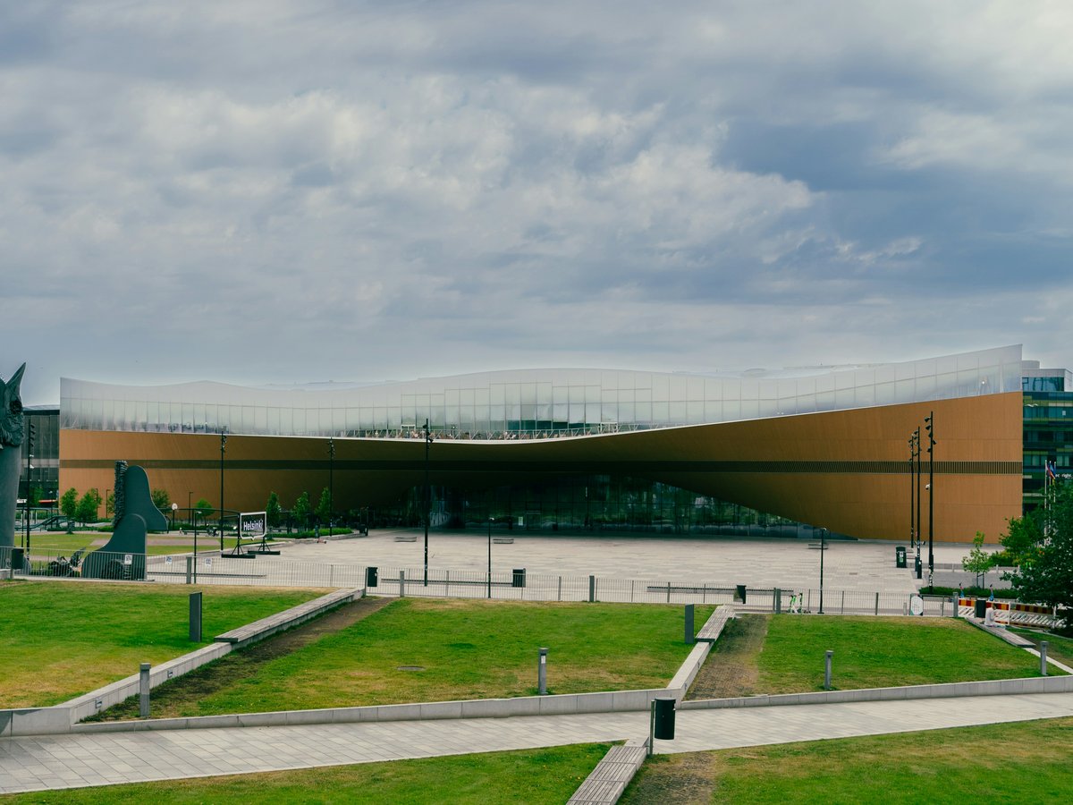 a large building with a statue in front of it