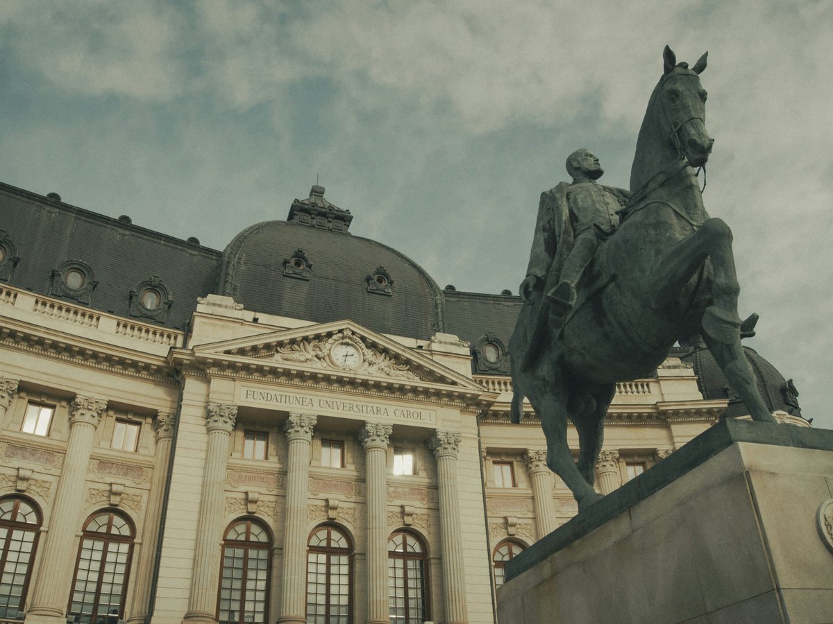 Equestrian statue in front of an ornate building