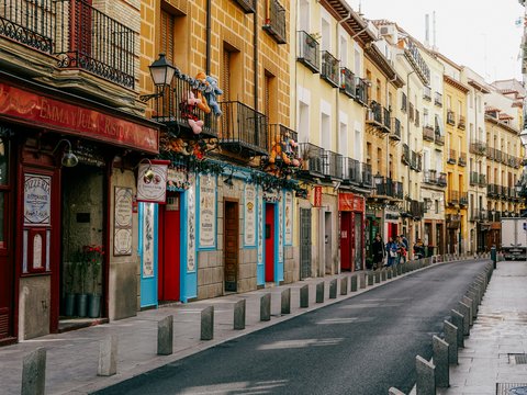 a street lined with tall buildings next to each other