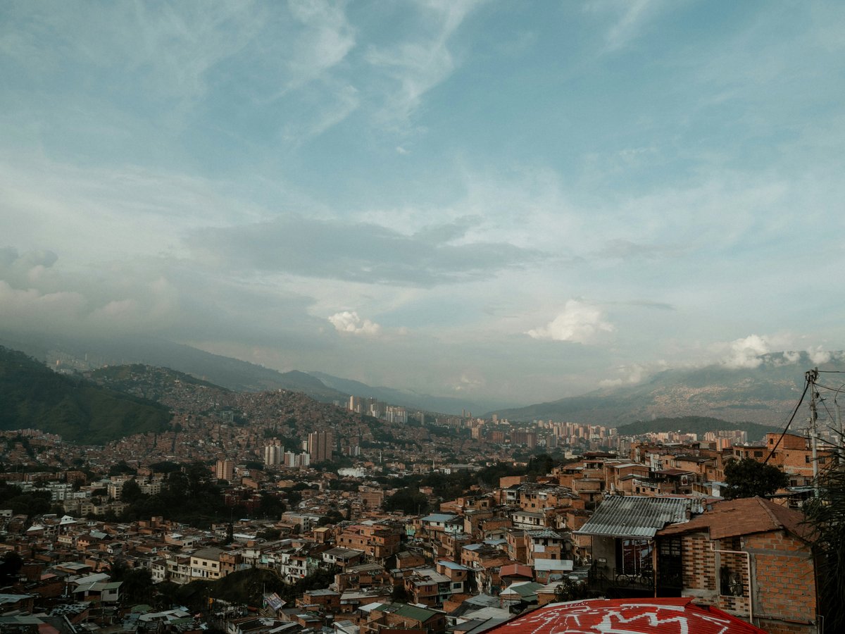 a view of a city with mountains in the background