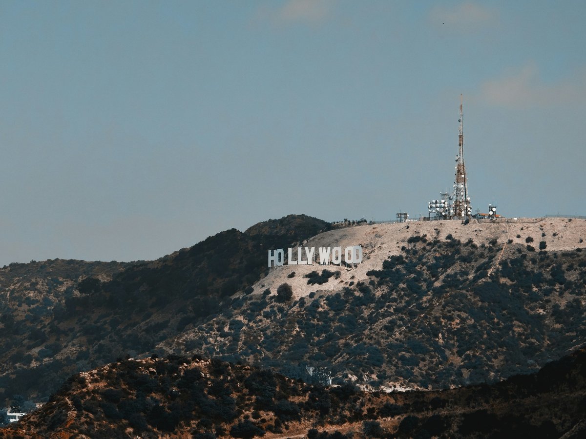 Hollywood sign on a hill under a clear blue sky