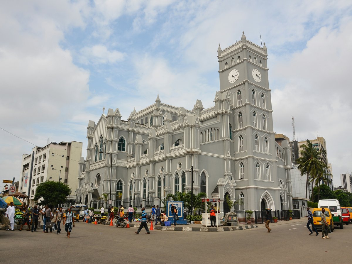 a large white building with a clock tower