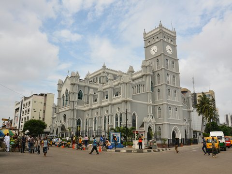 a large white building with a clock tower