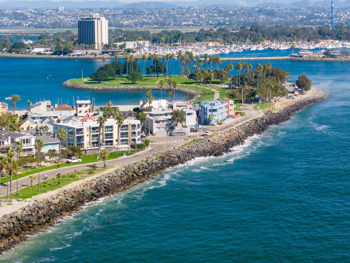 an aerial view of a city by the water