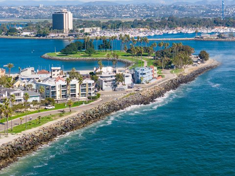 an aerial view of a city by the water