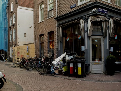 bicycles parked beside the road during daytime