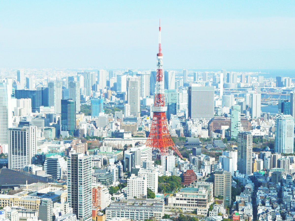 aerial photography of red tower surrounded by buildings during daytime