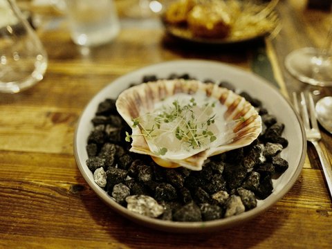 A bowl of food on a wooden table