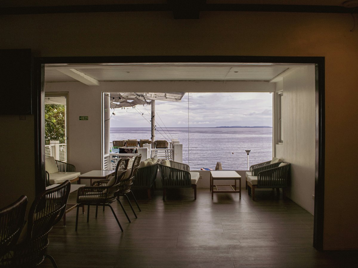 Empty cafe interior with a serene ocean view