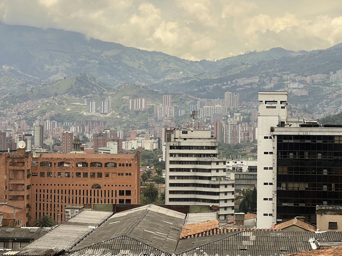 a city with mountains in the background