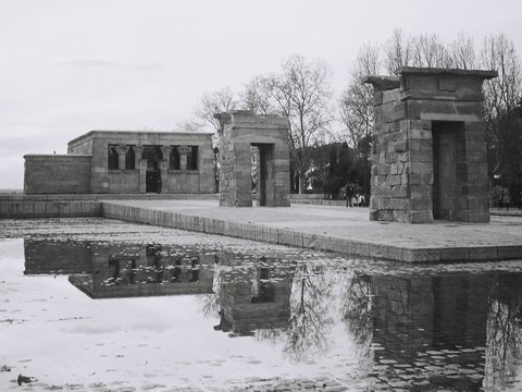 gray concrete building near body of water during daytime