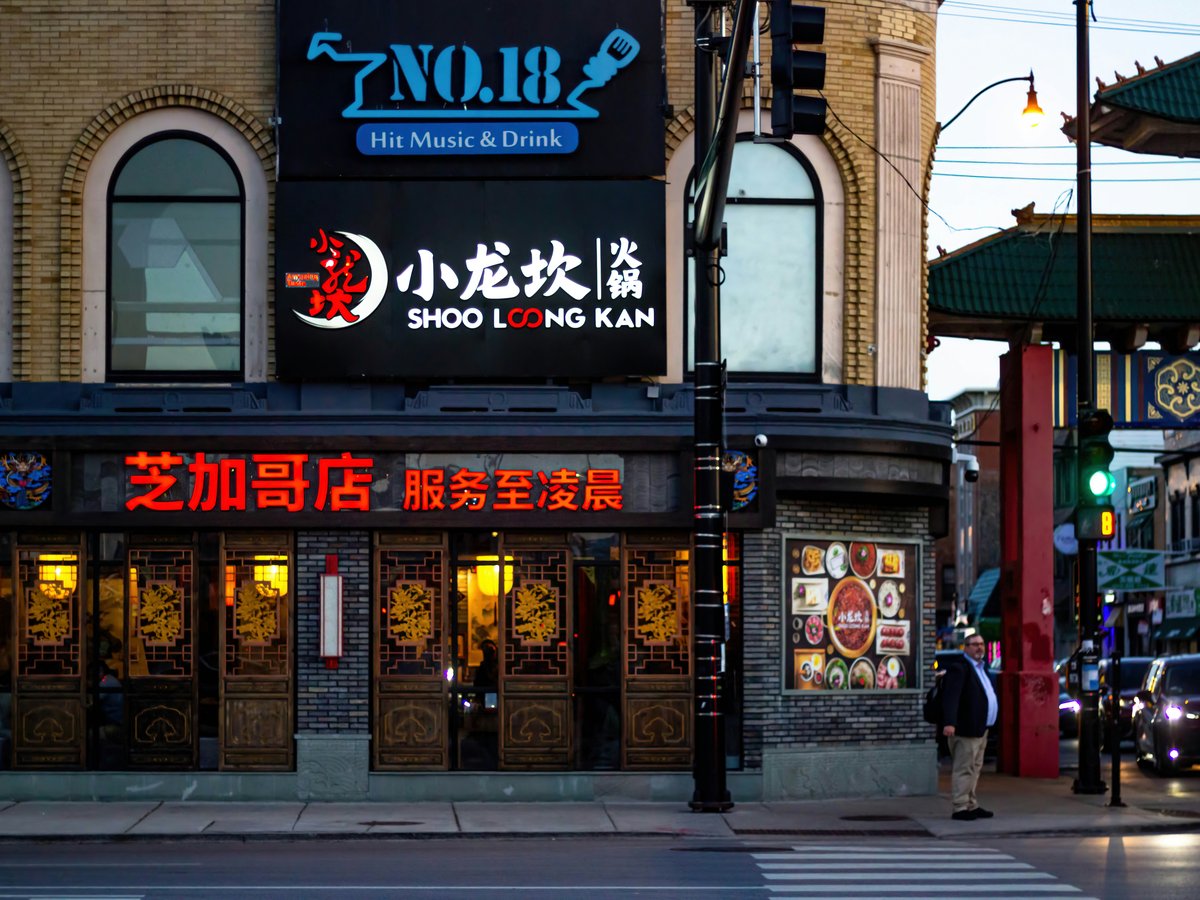 a chinese restaurant on a city street corner