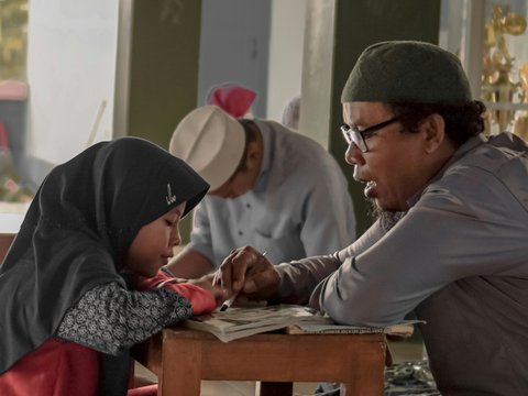 a person and a child looking at a book
