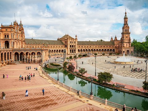 a large building with a fountain in front of it