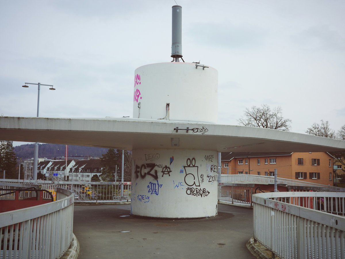 a white building with graffiti on the side of it