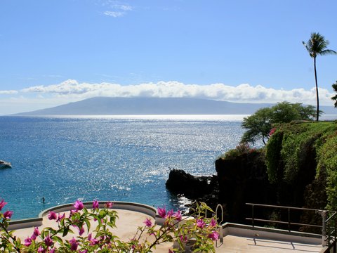 a view of a body of water with a mountain in the background
