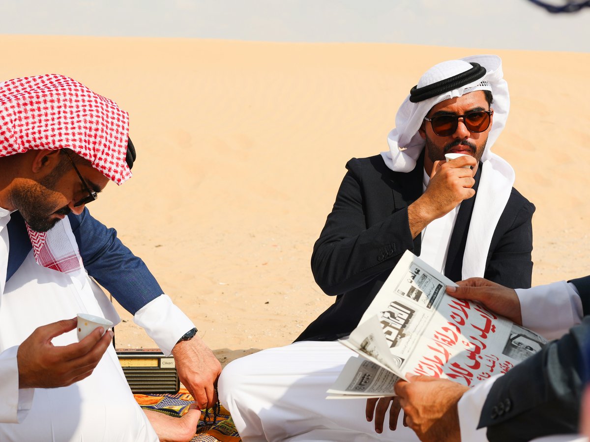 A group of men sitting next to each other