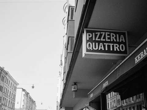 a black and white photo of a street corner