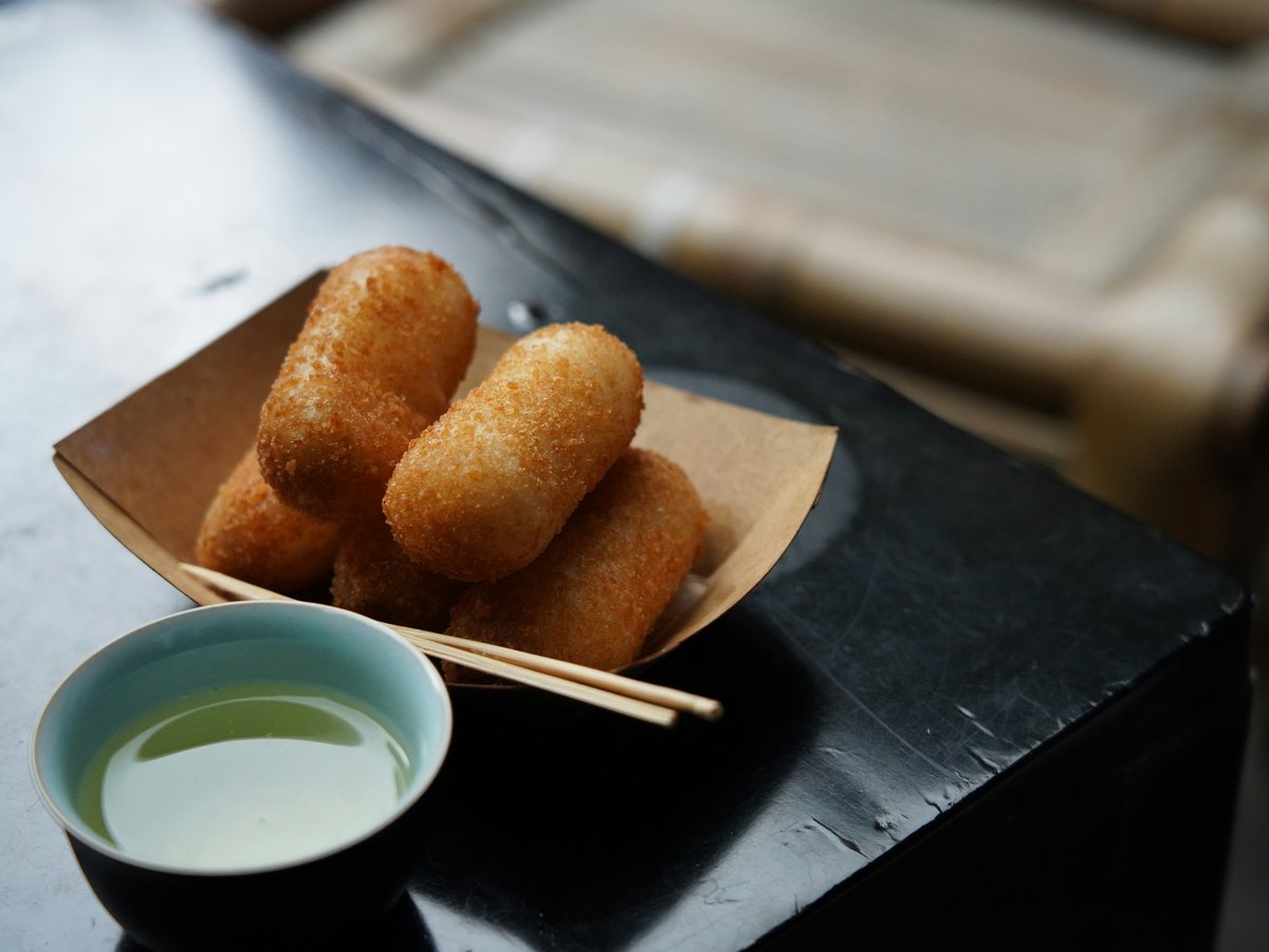 Golden fried croquettes served with dipping sauce