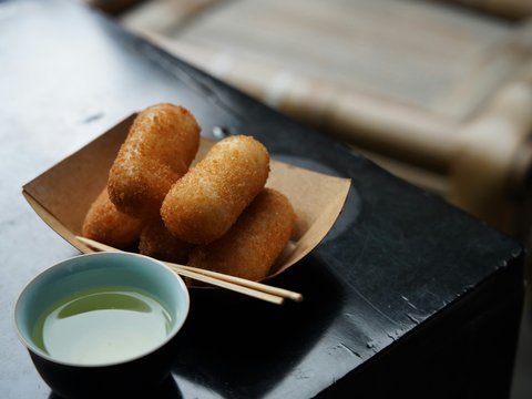 Golden fried croquettes served with dipping sauce