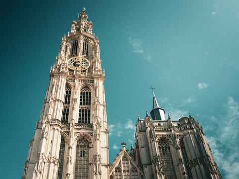 A tall church tower reaches for the sky.
