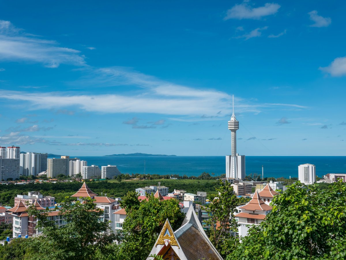 A view of a city with a tower in the background