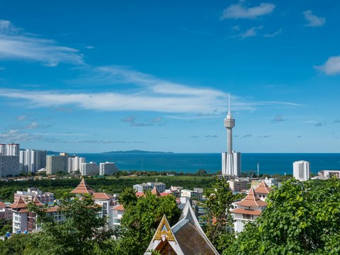A view of a city with a tower in the background