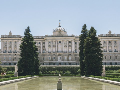a large building with trees in front of it