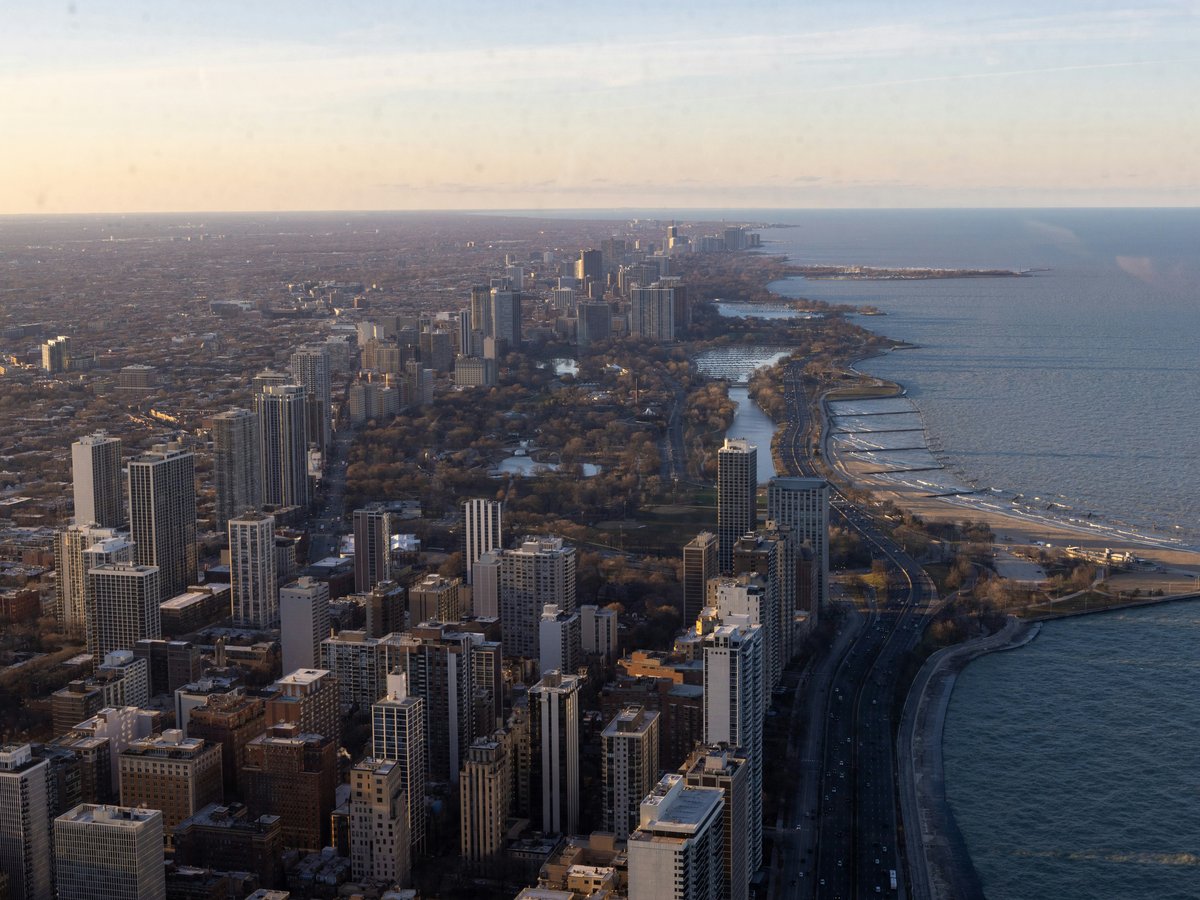Aerial view of a city skyline along the water.