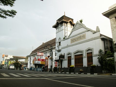 A historic building stands on a quiet street