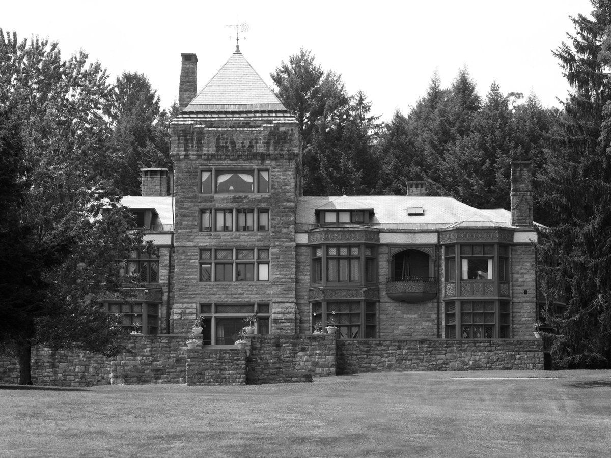 a black and white photo of a large brick building