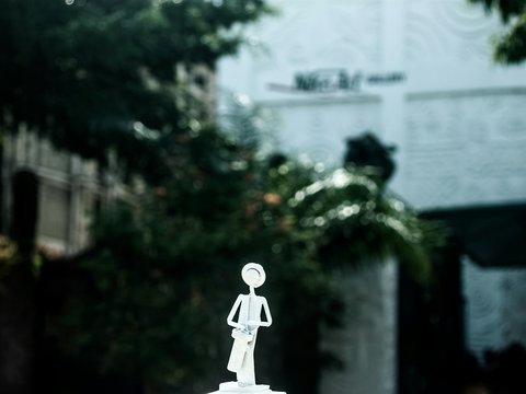 lighted decor of woman holding bag