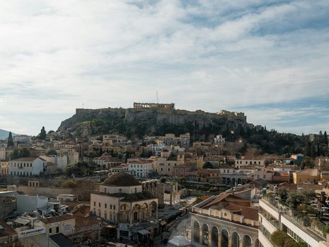 a view of a city with a hill in the background