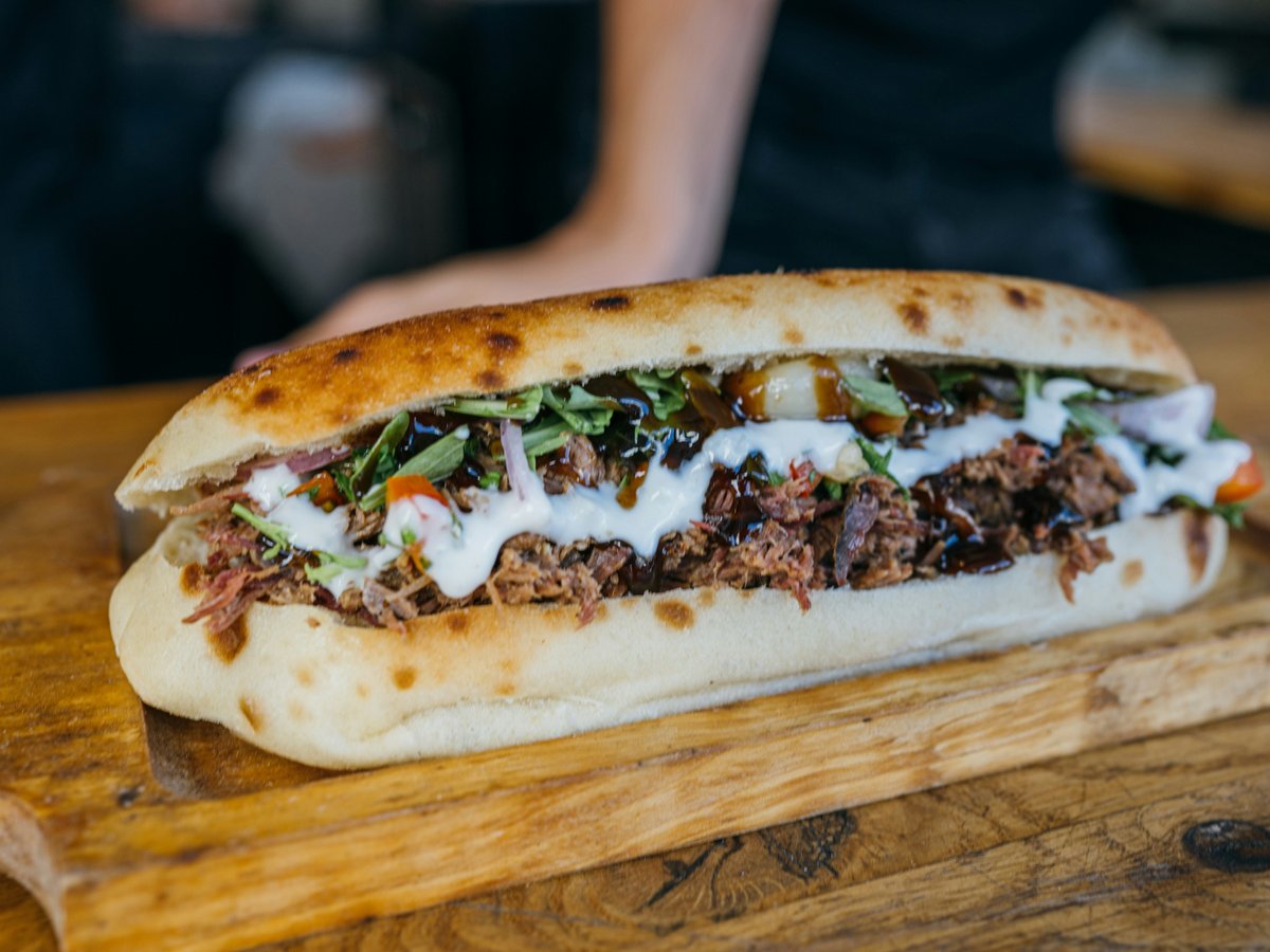 a close up of a sandwich on a cutting board