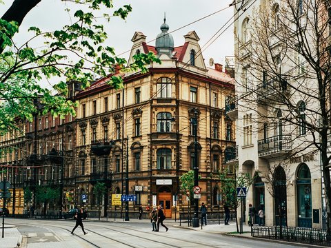 people walking near beige building