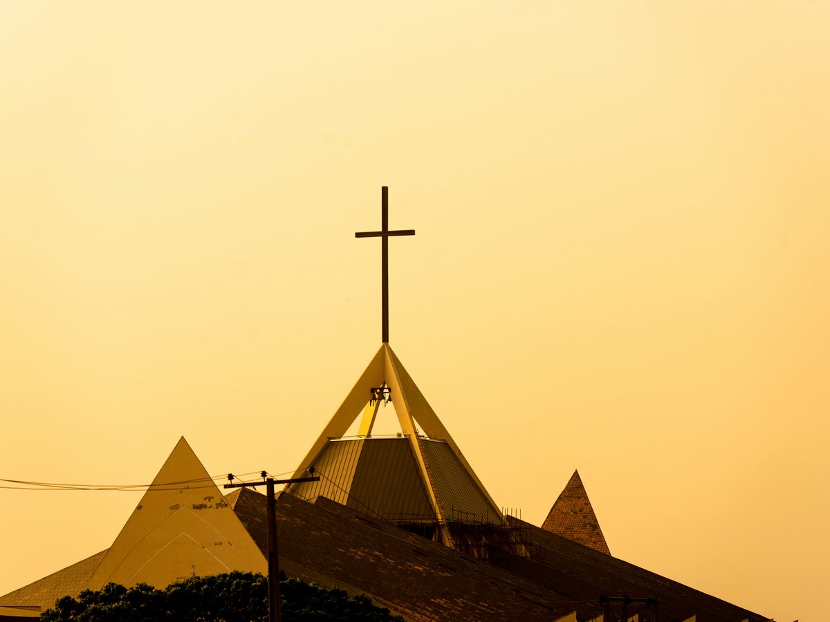a church steeple with a cross on top