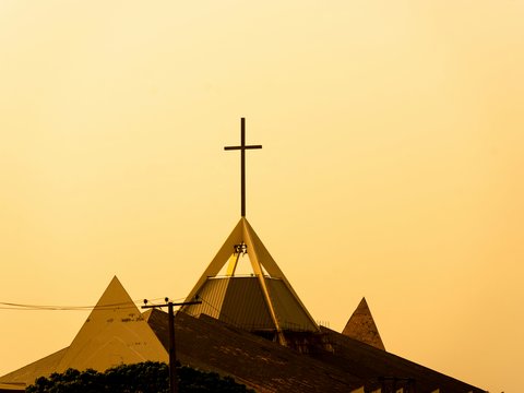 a church steeple with a cross on top